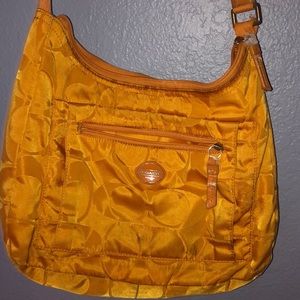 Mustard color authentic  Coach purse.